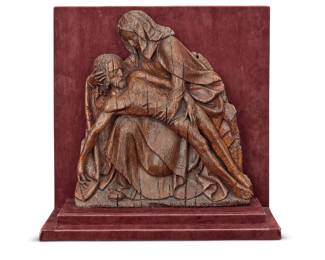 98 A Flemish carved oak mezzo relief of 'The Pieta' 16th century Depicting Christ wearing a perizonium and lying prostrate over the knees of Mary, mounted on a felt-lined stand Height of panel 14 3/4 in., width 13 in., depth 2 1/2 in.; height overall 16 7/8 in., width 16 3/8 in., depth 5 3/8 in. Estimate: $600 - $800