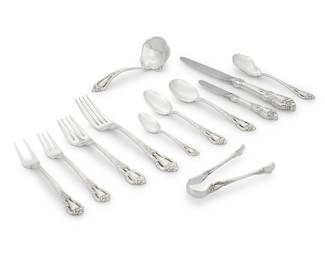 20 An extensive Lunt sterling silver 'Eloquence' flatware service Late 20th/early 21st century Designed 1952 Comprising: 16 dinner knives 16 butter spreaders 16 dinner forks 16 salad forks 16 cocktail forks 16 cream soup spoons 16 teaspoons 15 demitasse spoons 1 gravy ladle 1 sugar spoon 2 pickle/olive forks 1 sugar tongs Each with factory marks for sterling Together with one Rogers Bros. silver-plated demitasse spoon 133 pieces Total weighable sterling 130.7 oz. troy approximately Estimate: $5,000 - $8,000