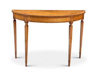 317 A George III style mixed wood inlaid demilune console Late 19th/early 20th century With applied paper label: JOLLY & SON LTD / REPOSITORY Height 33 3/4 in., width 48 1/4 in., depth 20 in. Estimate: $400 - $600