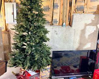 7.5 pre-lit multi-color pine Christmas tree, vintage Karosel Jr. rotating Christmas tree stand, Sony LCD tv