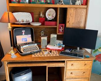 Solid oak desk and hutch, vintage Apple keyboard and mouse, and Dell monitor