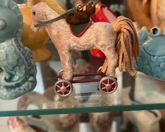 miniature flocked horse on wheeled platform small rider