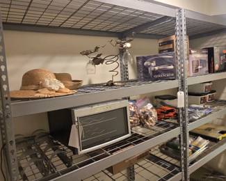 Two very large utility shelves are in the hallway leading to the sewing/Christmas room.
