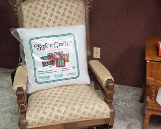 This antique rocking chair is in the basement to the left.