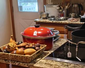 This is the kitchen, looking to the back deck area where you will find a grill, bench swing and a Big Green Egg.  There on the counter is a basket of wooden fruit.  Items like this are for looking and maybe even touching, but if you try to eat it, you will be on your own and I will act like I don't know you.