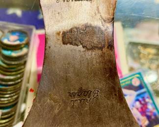 Genuine Norlund "Trail Blazer" double-bit cruiser axe head alongside its original embossed leather mask (sheath).