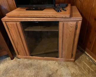 #014	Wood Entr. Center w/wood swivel TV Top w/2 Glass doors and DVD Racks and 3 shelves - 39x20x30	 $50.00 