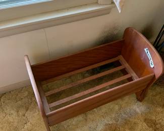 #054	Wood Doll Cradle - 24x14x17 (as is on wheels)	 $20.00 