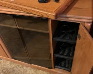 #014	Wood Entr. Center w/wood swivel TV Top w/2 Glass doors and DVD Racks and 3 shelves - 39x20x30	 $50.00 