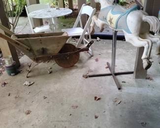 Yard art and real carousel horse