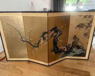 Antique Japanese byobu (folding screen), typically a 4-panel tabletop or small room screen featuring a painted bird (such as a pheasant or duck) and flowering plum/cherry blossoms against a gold leaf or gold-toned background.