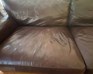 DETAIL OF LEATHER SOFA BY CRATE AND BARREL