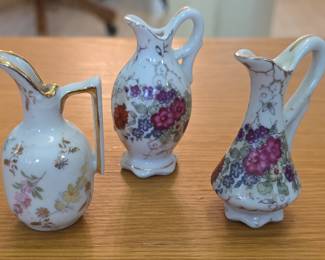 Set of Three Miniature Porcelain Floral Pitchers