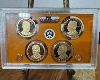 2013-S U.S. Mint Presidential Dollar Proof Set featuring four coins honoring U.S. presidents William McKinley, Theodore Roosevelt, William Howard Taft, and Woodrow Wilson