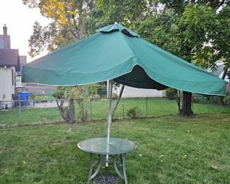 Outdoor umbrella including table