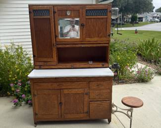 One of a kind Antique Oak BOONE Hoosier with swing out stool, swing out ironing board, original Arcade coffee grinder, Complete Flour sifter & more!