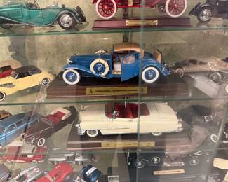 Two showcases full of diecast cars