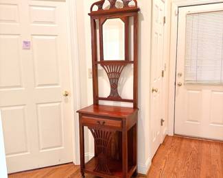 Victorian-style wooden hall tree stand
