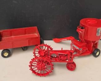 3 Piece Collection of 1/16 Scale Farmall Die Cast Tractor and 2 Implements