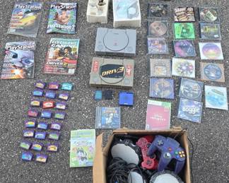 Collection of Vintage Video Game Items - Sony PlayStation 1 Console, Controllers, Strategy Guides