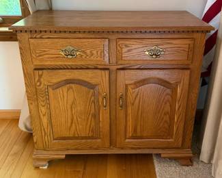 Vintage Oak Wood Two Drawer Storage Cabinet with Double Doors & Decorative Brass Tone Hardware - Lake Odessa Off-Site