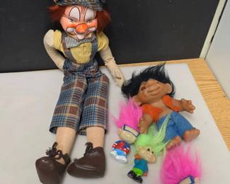 Large Clown Doll and Small Troll Dolls