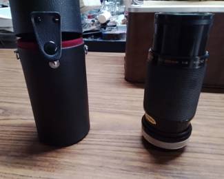 Vintage Kiron 80-200mm f/4 Macro Lens With A Tokina Cap And Its Protective Hard Case