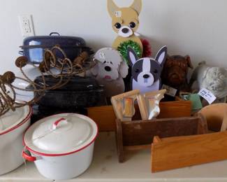 red/whie pots, blue speckled roasting pans, 2 pug dogs, 3 dogs, shelves