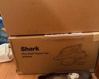 Boxed Shark Rocket Hand Vac and Go2 stick vac