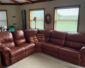 Large L-shaped red leather sectional sofa