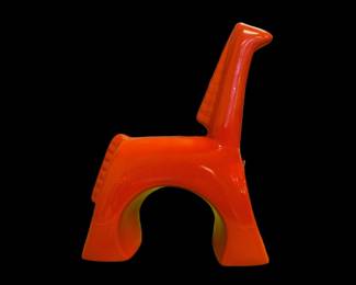 Bright orange glazed stylized horse figurine