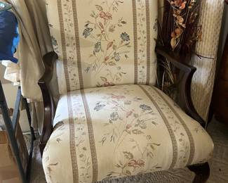 curved arm and leg upholstered chair 