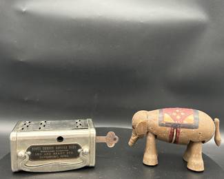Coin bank and wooden elephant