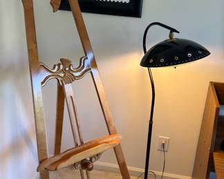 Ornate easel and vintage lamp