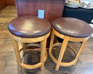    Wooden barstools with upholstered nailhead seats