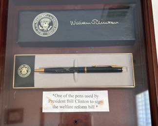     Framed William J. Clinton presidential pen and presentation box, with a label stating it was used to sign the welfare reform bill