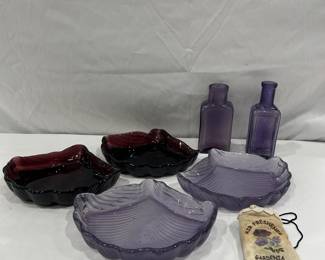 Purple red shell shaped glass bowls and bottles  