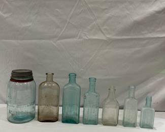 Antique medicine glass bottles and jar