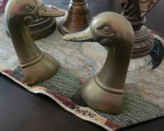 vintage pair of solid cast brass duck or mallard head bookends from the mid-20th century, approximately 6 inches