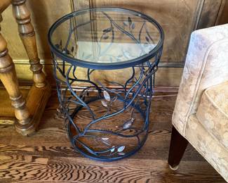 Metal glass table with birds
