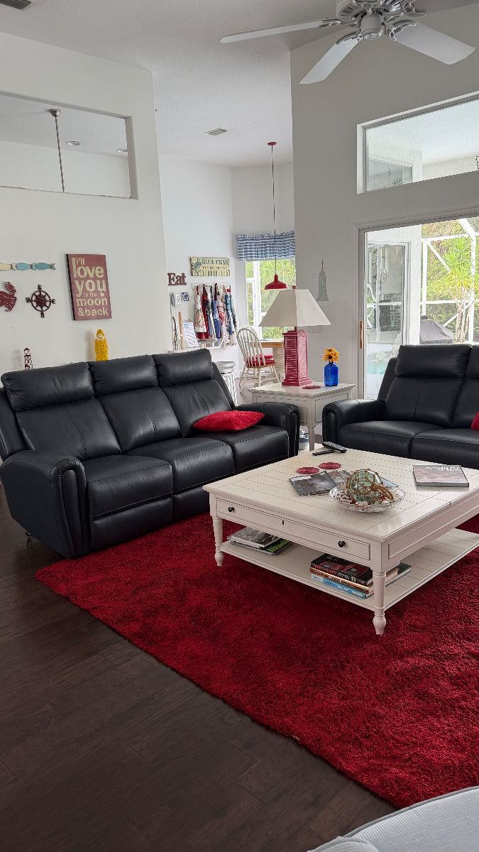 Dark blue leather sofa & loveseat with recliners