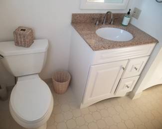 Commode; bath vanity; mirror; vanity lights
