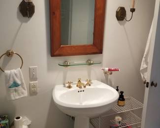 Pedestal sink; antique mirror