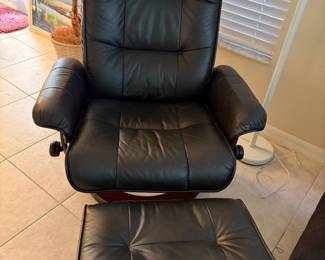 ergonomic swivel recliner chair with a matching footstool ottoman