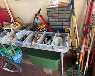 assorted garage stuff, gardening tools, hand tools