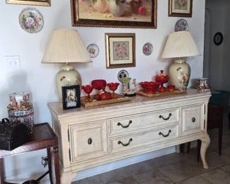 Furniture sideboard  not for sale. On top sits a collection of Amberina glass on gold gilded matching mirrors and other collectible  items.