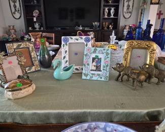 Vintage picture frames with complementary  vintage  vase, swans and elephant 