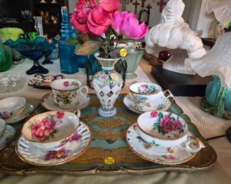 Vintage ornate tea cups and matching saucers on a gold and turquoise  Florentin  Italian serving tray and other selct items.