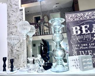Large collection of tall candlesticks