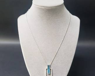 004 Lot 137 14k white gold diamond and blue topaz pendant